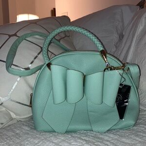 Crossi Cute Bow Mint Green Purse NWT
Compliment your summer dress
